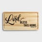 Our 'Lord, Bless This Home' decorative cutting board adds beautiful inspiration to your kitchen décor and can be easily displayed on a wall or easel. The Proverbs 3:33 Scripture message reminds us that the Lord blesses the righteous.