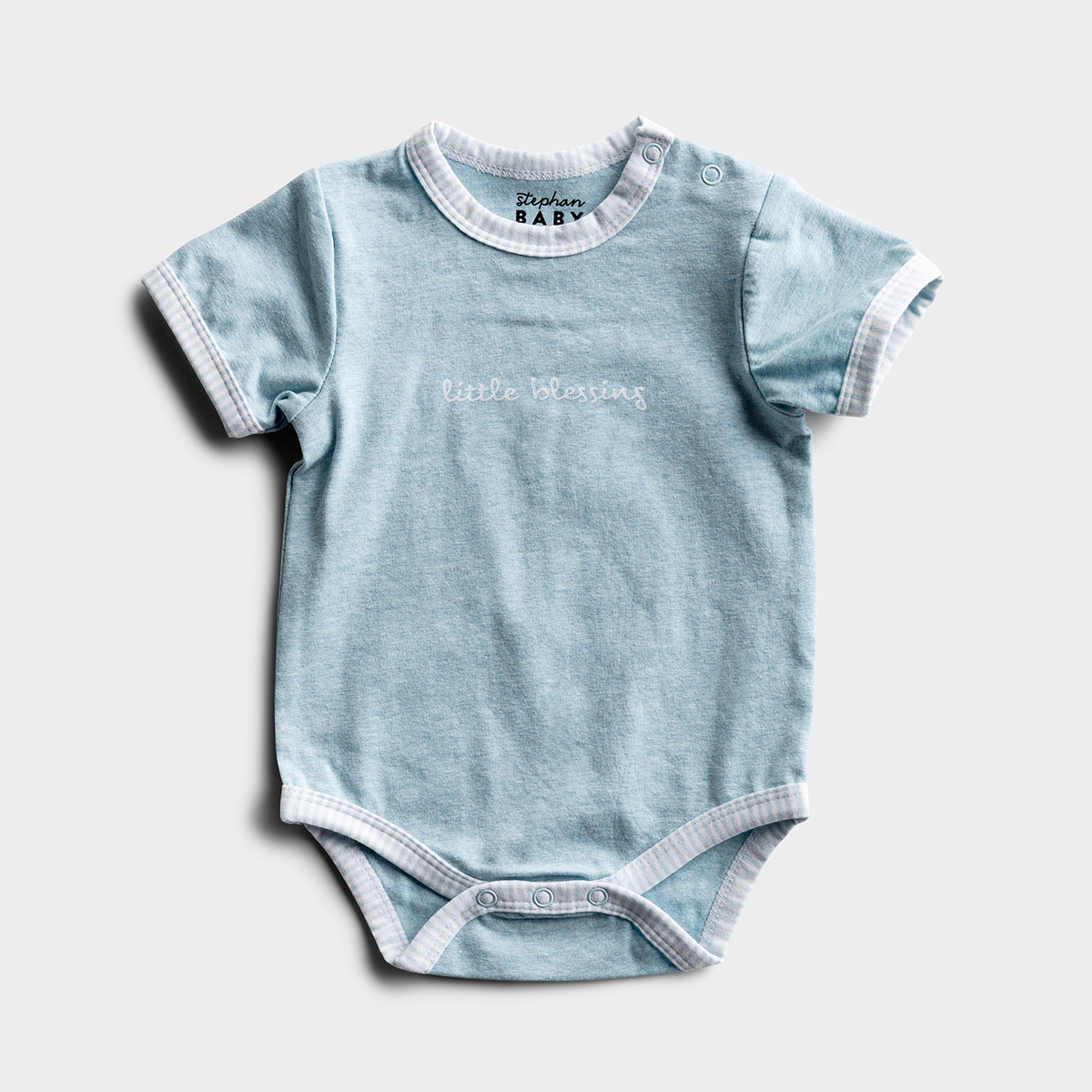 This 'Little Blessing' inspirational baby bodysuit is designed to dress precious little ones in adorable style and meaningful inspiration. This blue, baby one-piece, with blue-striped accents, snaps at neck and bottom for easy dressing and shares a sweet 